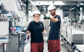 a man and a woman wearing hard hats and gloves